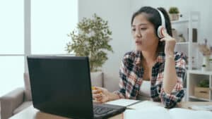 Girl Hearing An Audio Recording Via A Headphone