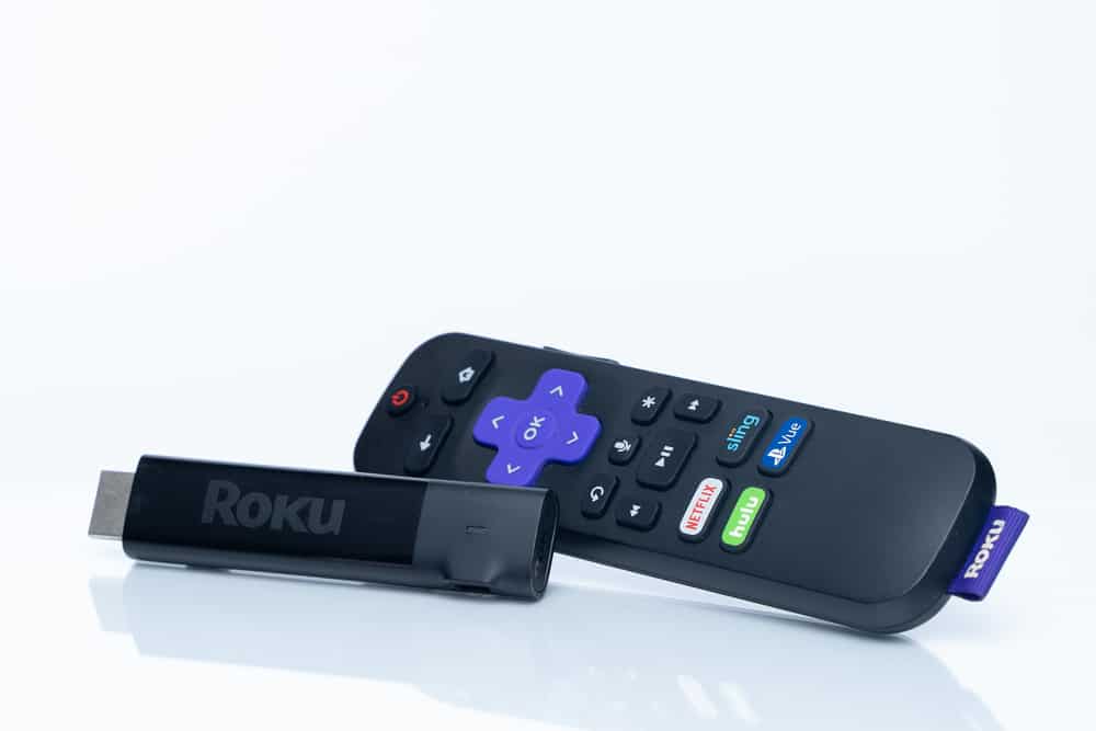 A Roku Device With A Tv Remote By Its Side