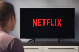 A Young Man Watching Netflix On An Lg Tv