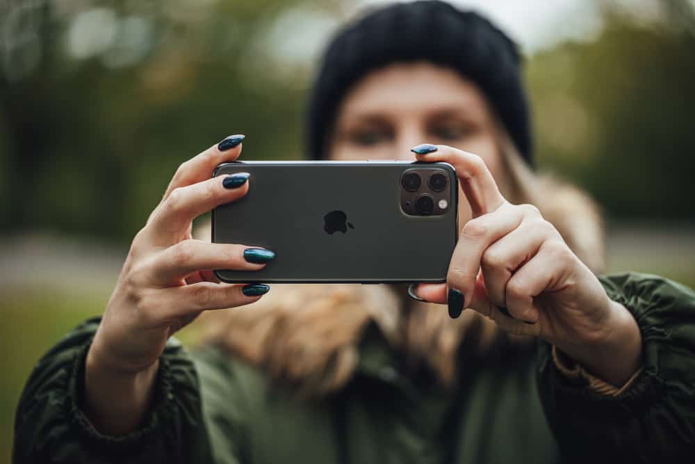 Woman Taking Picture With Iphone