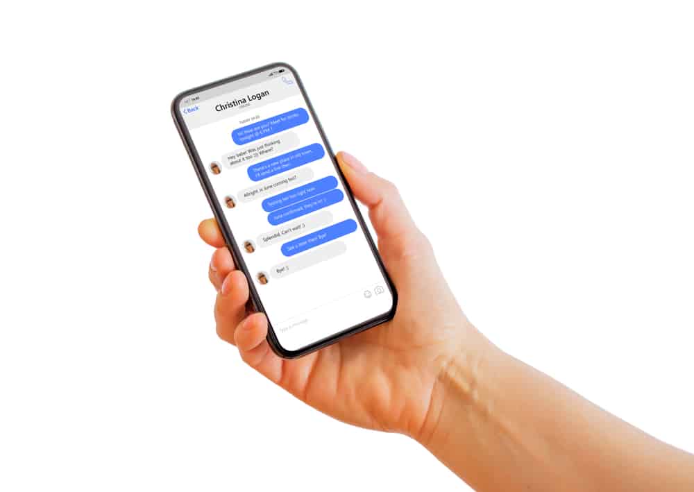 Man Holding Iphone With Message Chat